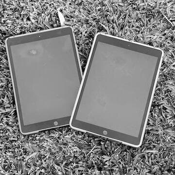 Two tablets side by side on a table